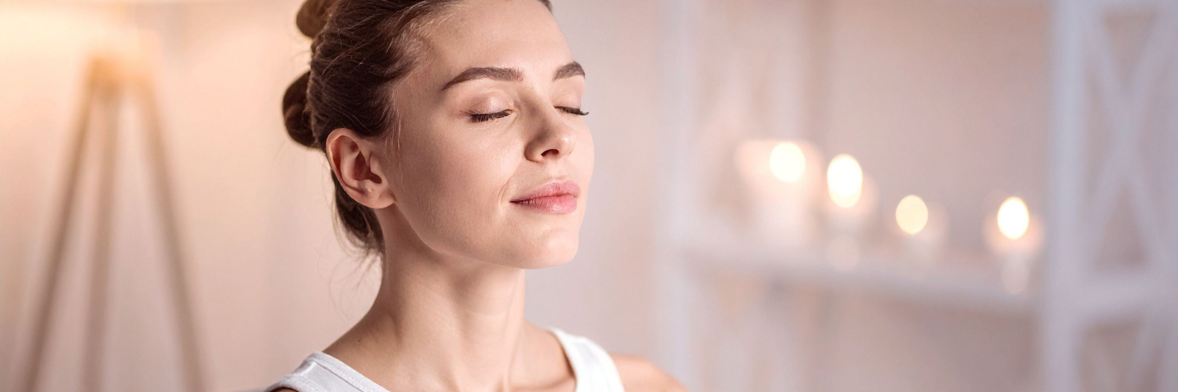 Woman meditating in luxury setting