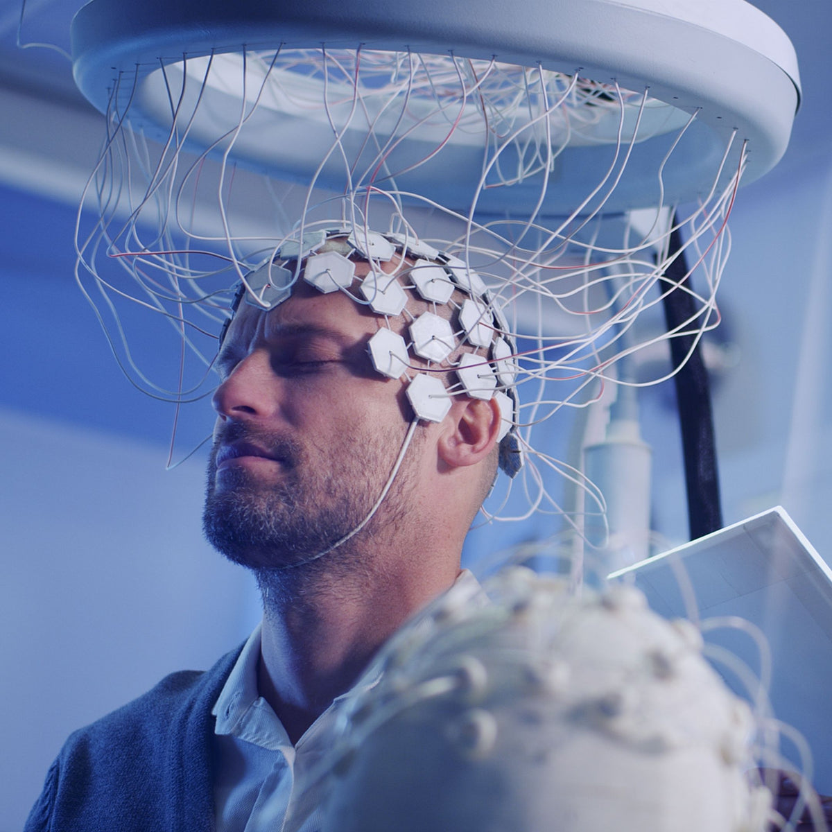 Image of neuroscience research and information about how our proprietary meditation experiences use brainwave entrainment to bring participants brainwaves to a restorative theta state.