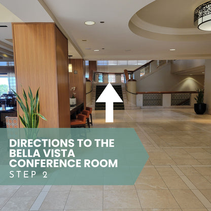 Interior of a conference room with directional text and an arrow pointing upwards for Sound Meditation directions.