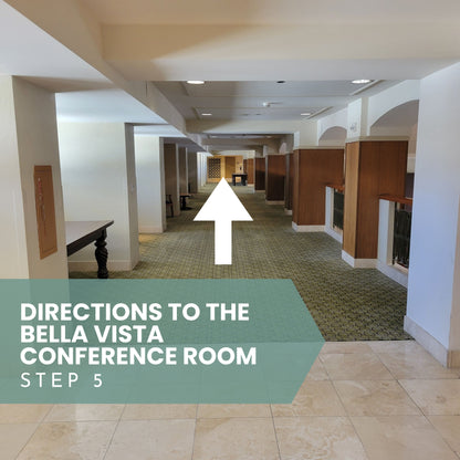 Indoor hallway with directional text and arrow pointing to Bella Vista Conference Room for Sound Meditation.